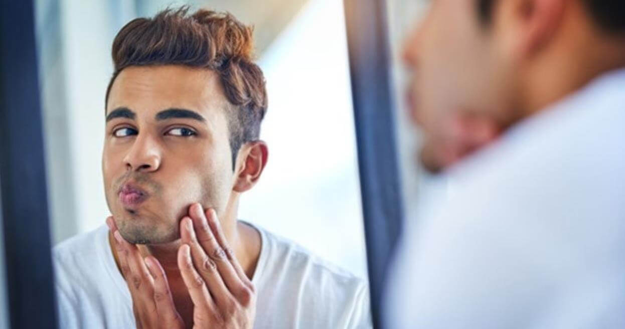 9 Facial Exercises for Men to Slim Face Fat and Chisel Your Jawline