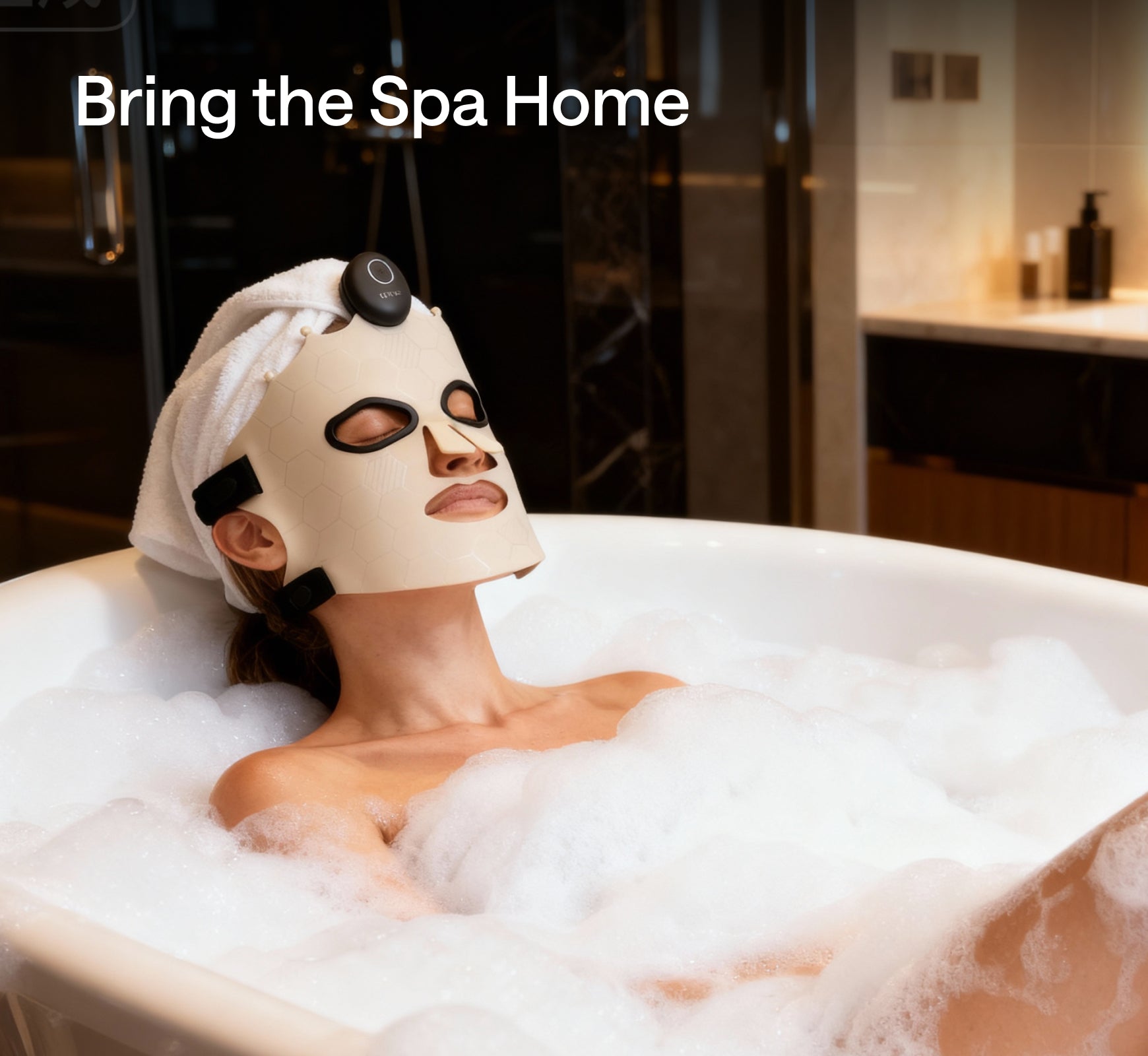 Woman wearing Ulike LED light therapy mask while relaxing in a bubble bath at home