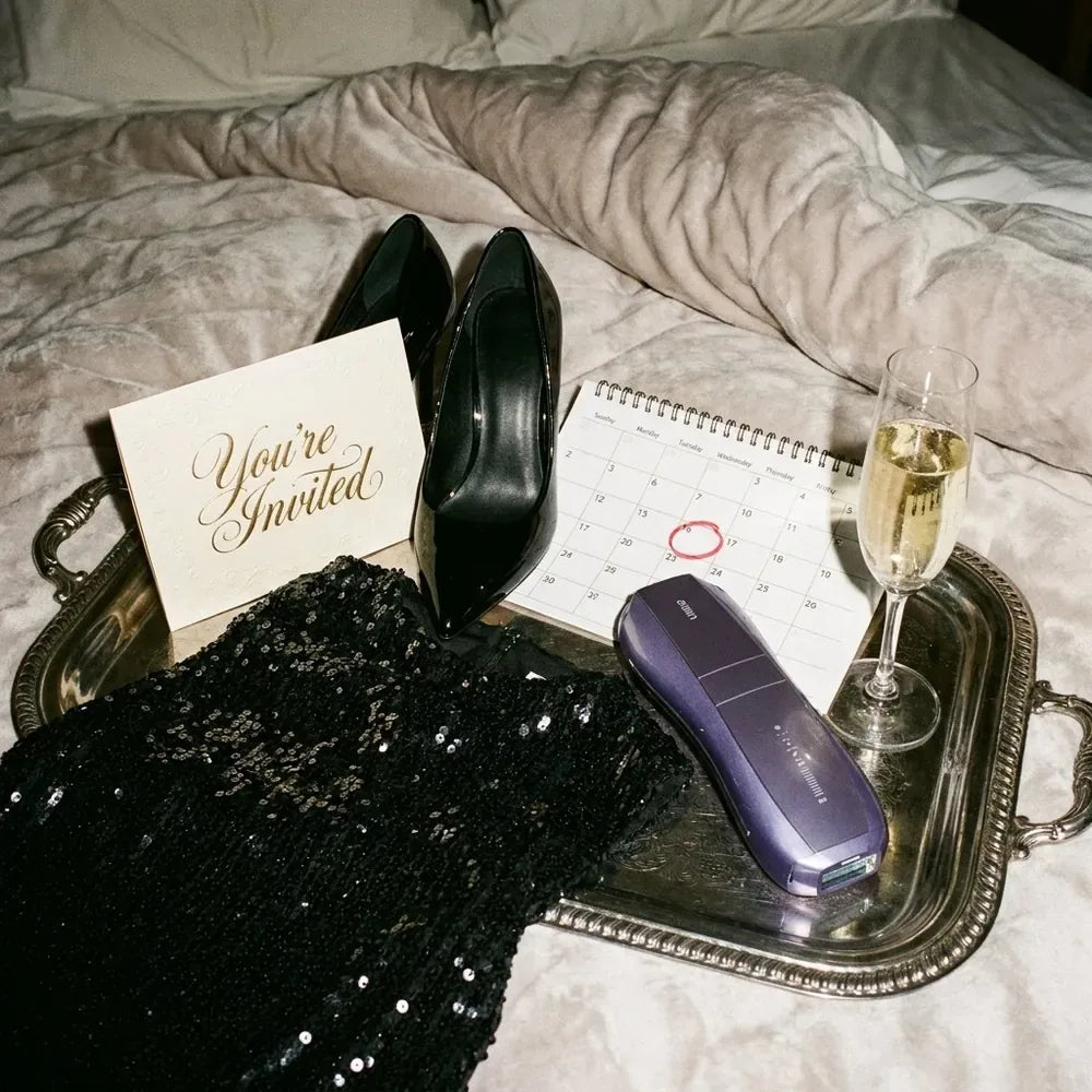 A 'You're invited' card, black heels, a sequin dress, a calendar and the Air 10 on a silver tray with champagne